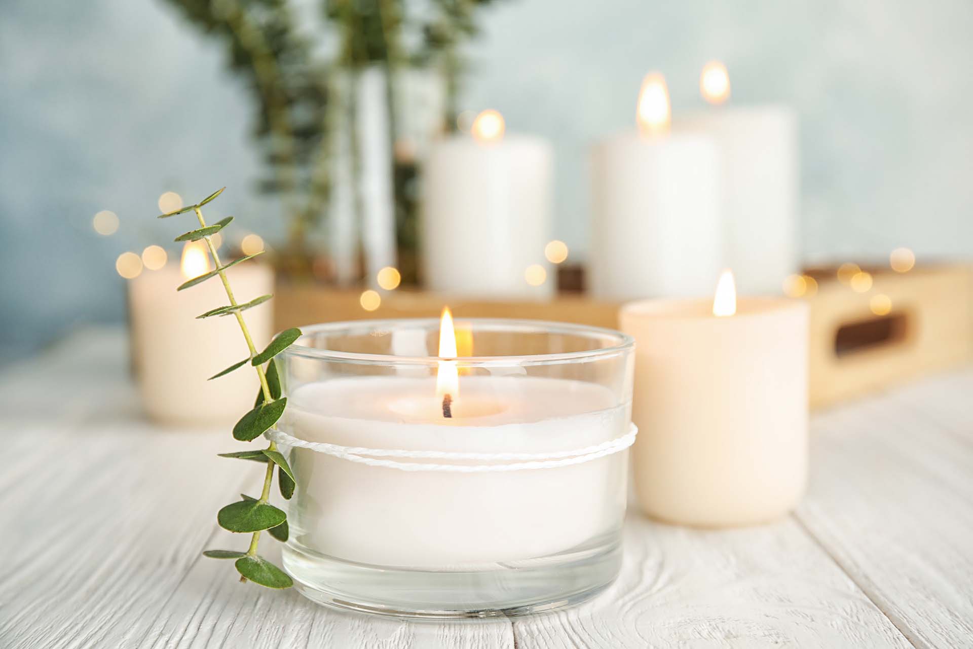 Product Photography Tips: a staged photo of candles which are lit, serne calm and relaxing story told in the image